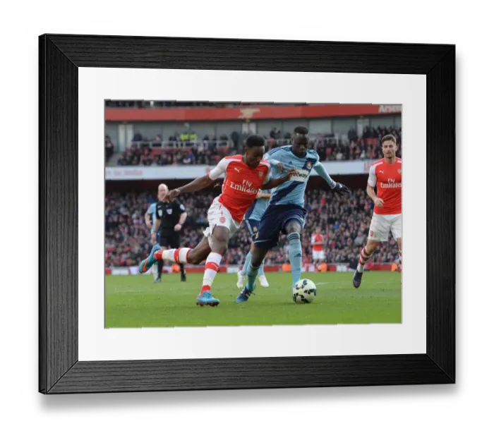 Framed Print : Arsenal's Danny Welbeck Clashes with West Ham's Cheikhou Kouyate during the Premier League Match Framed Print : Arsenal's Danny Welbeck Clashes with West Ham's Cheikhou Kouyate during the Premier League Match