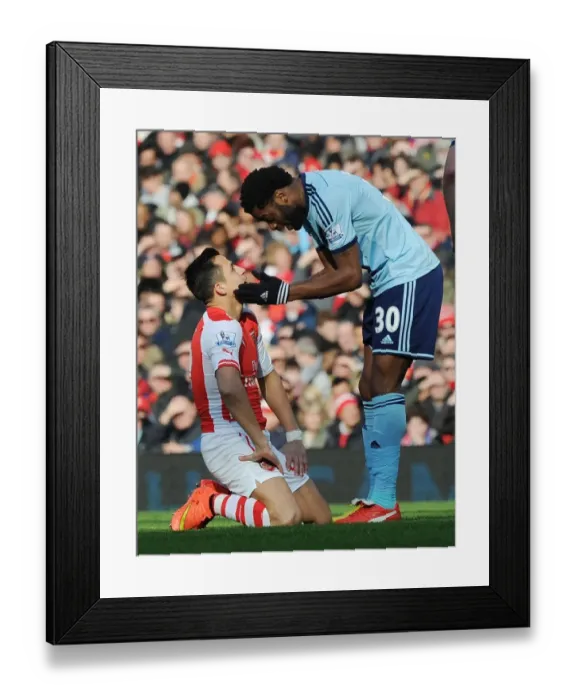 Framed Print : Arsenal vs. West Ham United: Clash Between Sanchez and Song in the Premier League