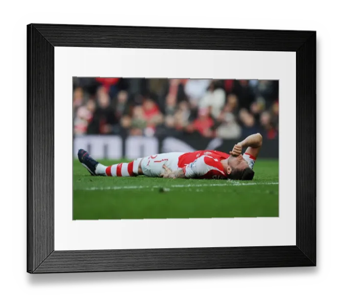 Framed Print : Arsenal's Olivier Giroud in Action against West Ham United - Premier League 2014 / 15