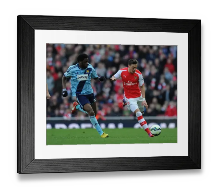 Framed Print : Clash of the Past Teammates: Ozil vs Song in Arsenal vs West Ham United (2015)