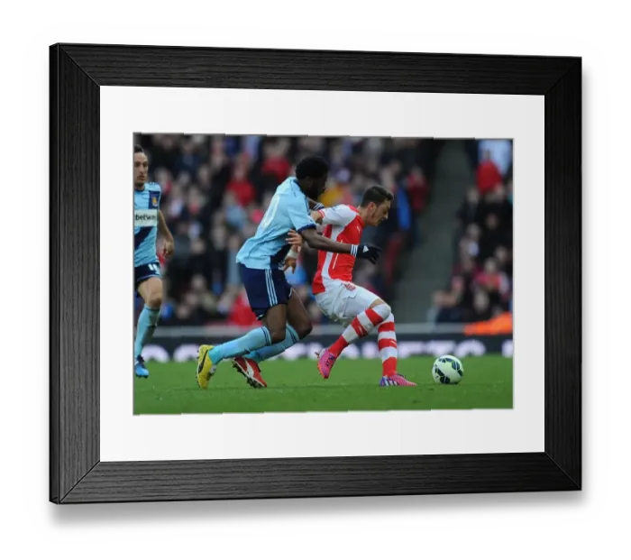 Framed Print : Clash of the Past Teams: Ozil vs. Song - Arsenal vs. West Ham United (2015)