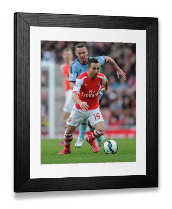 Framed Print : Arsenal's Santi Cazorla Dashes Past West Ham's Kevin Nolan in Premier League Clash