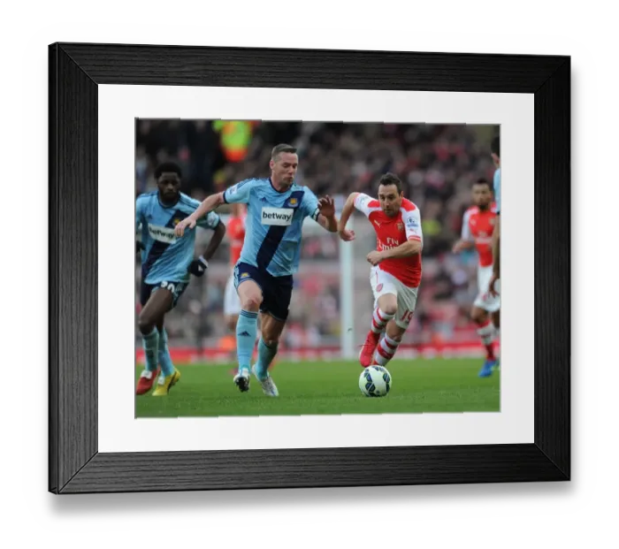 Framed Print : Santi Cazorla's Agile Moves: Outmaneuvering Kevin Nolan in Arsenal's Premier League Victory