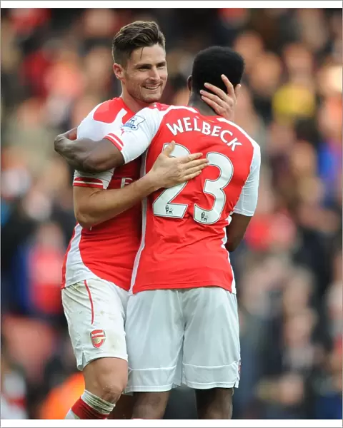 Arsenal's Premier League Victory: Giroud and Welbeck Celebrate with Arms Raised