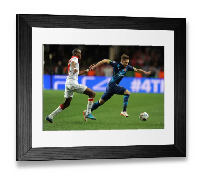 Framed Print : Arsenal's Aaron Ramsey Dashes Past Monaco's Geoffrey Kondogbia in UEFA Champions League Showdown