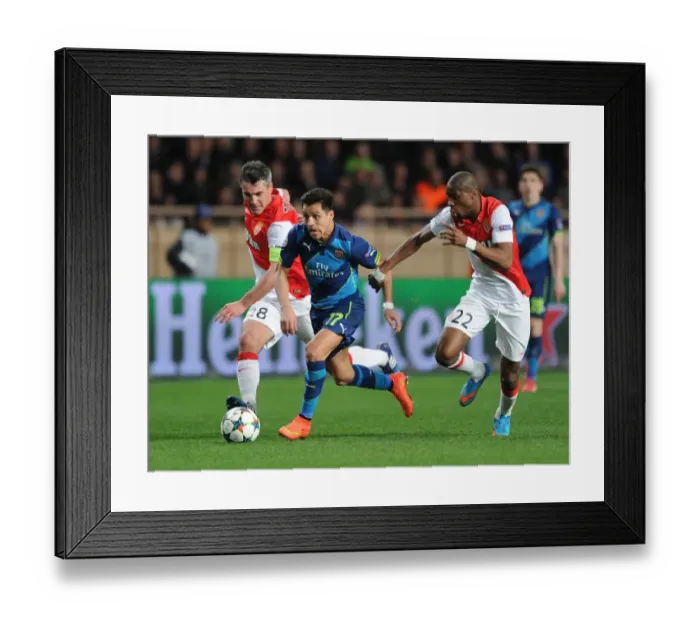 Framed Print : Alexis Sanchez Breaks Past Monaco's Defense in Arsenal's UEFA Champions League Clash
