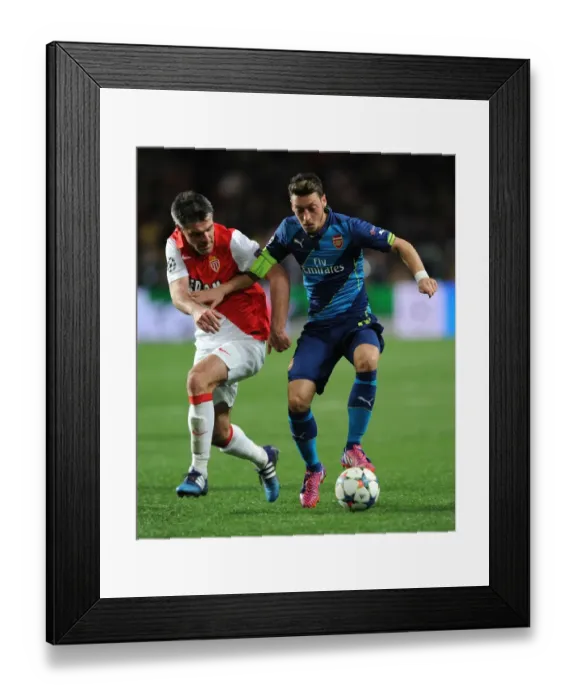 Framed Print : Mesut Ozil vs. Jeremy Toulalan: Intense Clash in Monaco's UCL Showdown against Arsenal