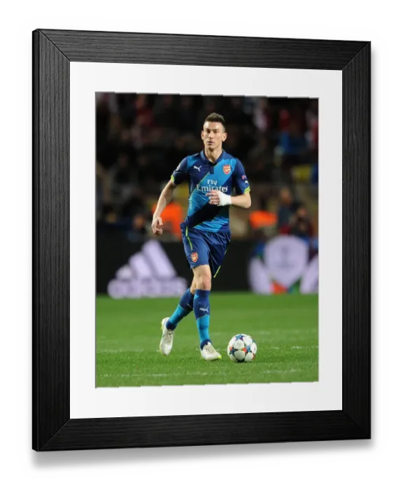 Framed Print : Laurent Koscielny (Arsenal). AS Monaco 0: 2 Arsenal. UEFA Champions League. Round of 16, 2nd Leg Framed Print : Laurent Koscielny (Arsenal). AS Monaco 0: 2 Arsenal. UEFA Champions League. Round of 16, 2nd Leg