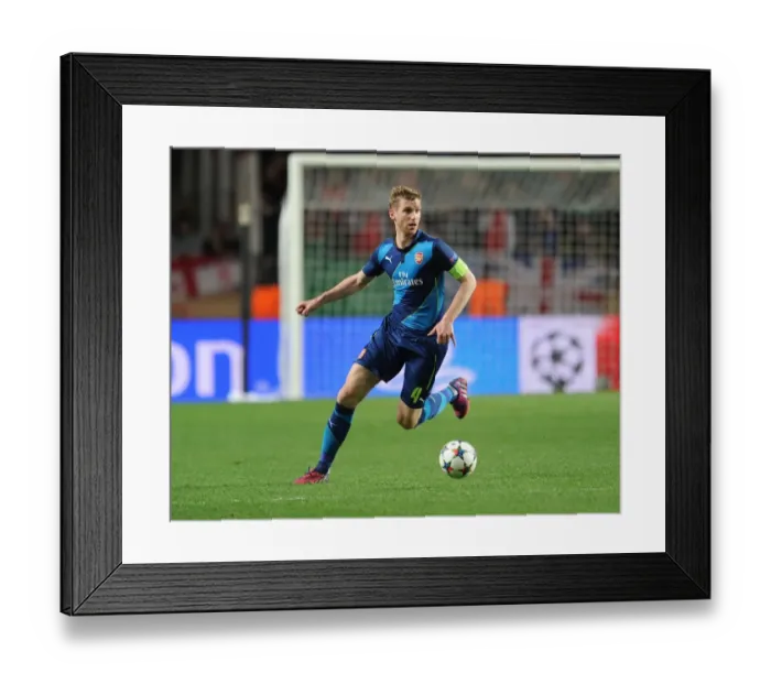 Framed Print : Per Mertesacker Focuses in Monaco Showdown: Arsenal vs. AS Monaco, UEFA Champions League Round of 16