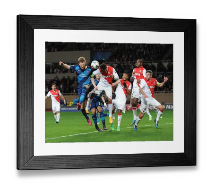 Framed Print : Per Mertesacker (Arsenal) Nabil Dirar (Monaco). AS Monaco 0: 2 Arsenal. UEFA Champions League Framed Print : Per Mertesacker (Arsenal) Nabil Dirar (Monaco). AS Monaco 0: 2 Arsenal. UEFA Champions League