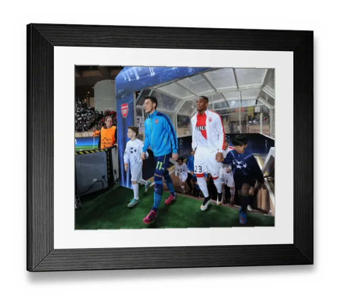 Framed Print : Mesut Ozil and Anthony Martial: Clash of Stars in Monaco's Champion's League Showdown Against Arsenal