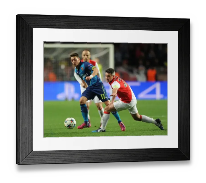 Framed Print : Mesut Ozil vs. Jeremy Toulalan: Battle for Ball Possession in Monaco vs. Arsenal, UEFA Champions League 2015