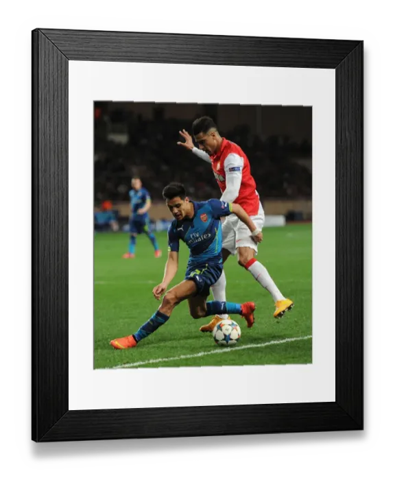 Framed Print : Clash of Stars: Sanchez vs. Dirar in Monaco vs. Arsenal UEFA Champions League Showdown Framed Print : Clash of Stars: Sanchez vs. Dirar in Monaco vs. Arsenal UEFA Champions League Showdown