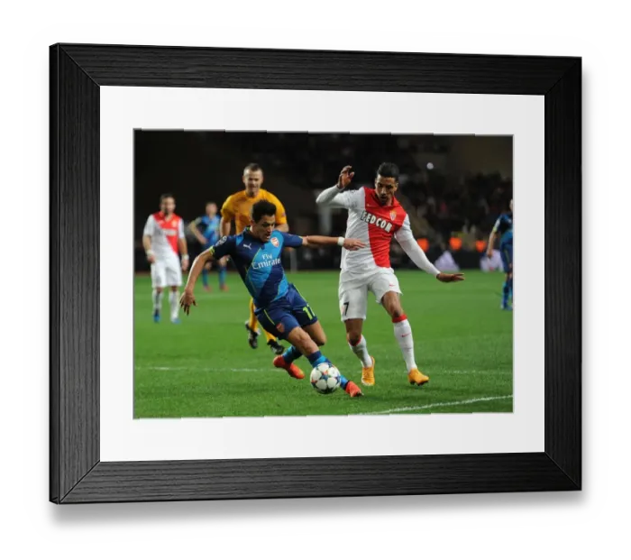 Framed Print : Clash of Stars: Sanchez vs. Dirar - Monaco vs. Arsenal UEFA Champions League Showdown Framed Print : Clash of Stars: Sanchez vs. Dirar - Monaco vs. Arsenal UEFA Champions League Showdown