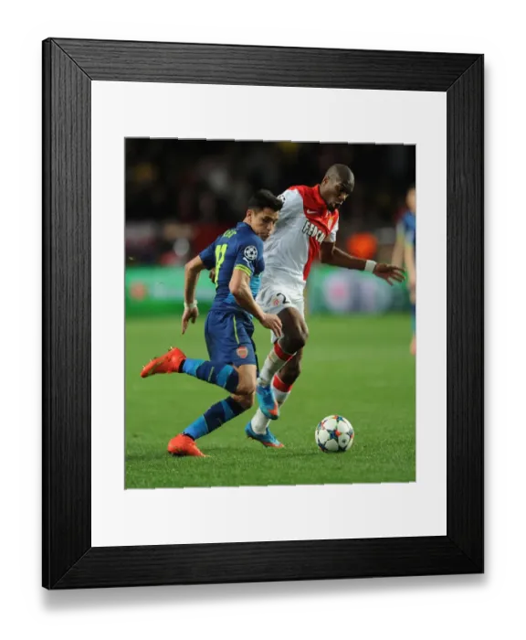 Framed Print : Clash of Stars: Alexis Sanchez vs. Geoffrey Kondogbia - Monaco vs. Arsenal, UEFA Champions League Round of 16 Framed Print : Clash of Stars: Alexis Sanchez vs. Geoffrey Kondogbia - Monaco vs. Arsenal, UEFA Champions League Round of 16