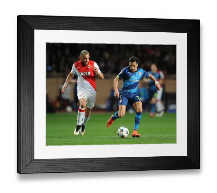 Framed Print : Clash of Stars: Sanchez vs. Kurzawa in Monaco-Arsenal UEFA Champions League Showdown Framed Print : Clash of Stars: Sanchez vs. Kurzawa in Monaco-Arsenal UEFA Champions League Showdown
