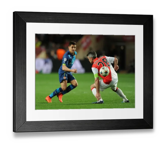 Framed Print : Clash of Titans: Sanchez vs. Toulalan - Monaco vs. Arsenal, UEFA Champions League Round of 16 Framed Print : Clash of Titans: Sanchez vs. Toulalan - Monaco vs. Arsenal, UEFA Champions League Round of 16