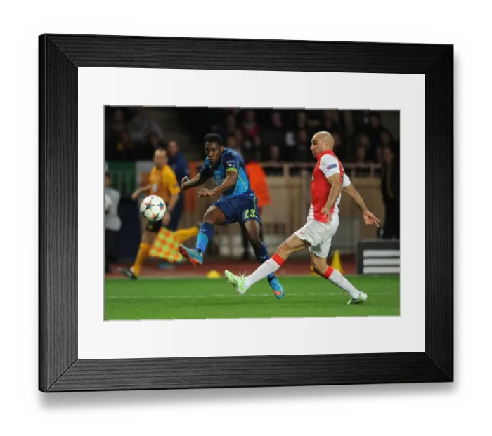 Framed Print : Danny Welbeck vs. Aymen Abdennour: Intense Moment from Arsenal's UEFA Champions League Clash with Monaco