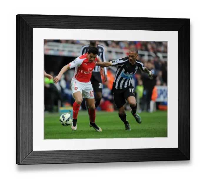 Framed Print : Intense Rivalry: Alexis Sanchez vs. Yoan Gouffran - Arsenal's Battle in Newcastle Framed Print : Intense Rivalry: Alexis Sanchez vs. Yoan Gouffran - Arsenal's Battle in Newcastle