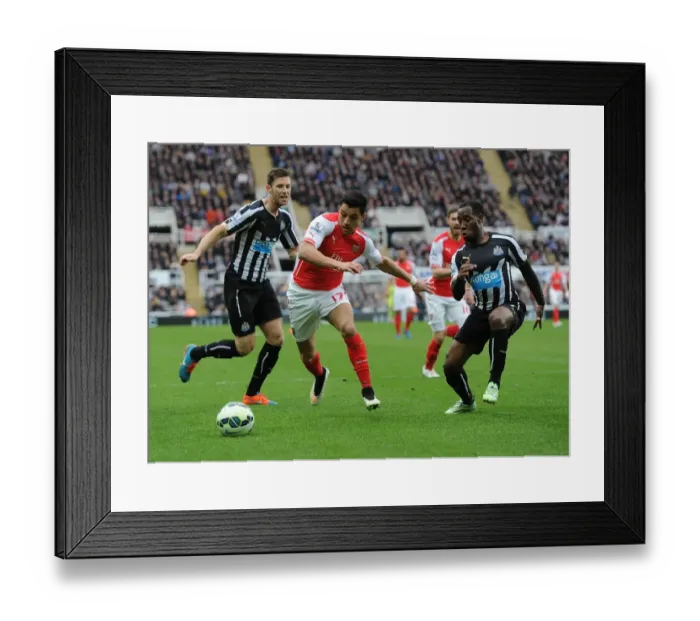 Framed Print : Arsenal's Alexis Sanchez Outmaneuvers Newcastle's Defense in Premier League Clash