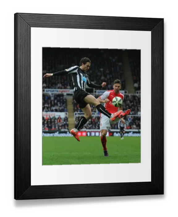 Framed Print : Giroud vs. Janmaat: Intense Clash Between Newcastle and Arsenal in Premier League