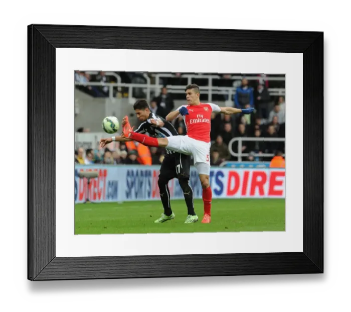 Framed Print : Gabriel vs. Ayoze Perez: Intense Battle in Newcastle United vs. Arsenal Premier League Clash Framed Print : Gabriel vs. Ayoze Perez: Intense Battle in Newcastle United vs. Arsenal Premier League Clash