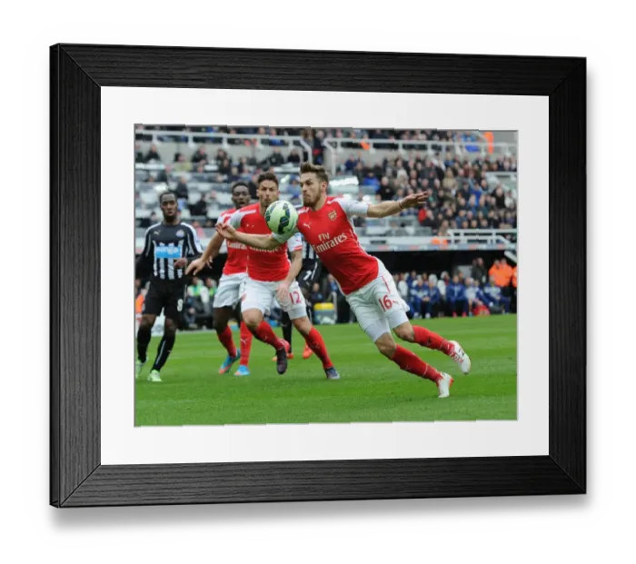 Framed Print : Aaron Ramsey in Action: Arsenal vs. Newcastle United, Premier League 2014-2015 Framed Print : Aaron Ramsey in Action: Arsenal vs. Newcastle United, Premier League 2014-2015