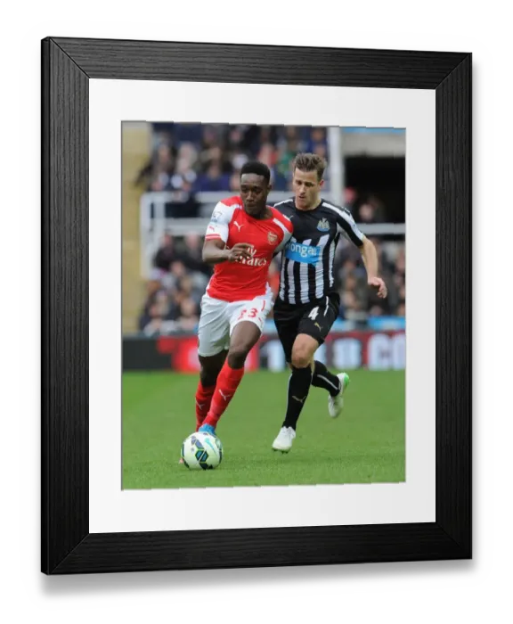 Framed Print : Danny Welbeck vs. Ryan Taylor: Intense Battle in Newcastle United vs. Arsenal Premier League Clash Framed Print : Danny Welbeck vs. Ryan Taylor: Intense Battle in Newcastle United vs. Arsenal Premier League Clash