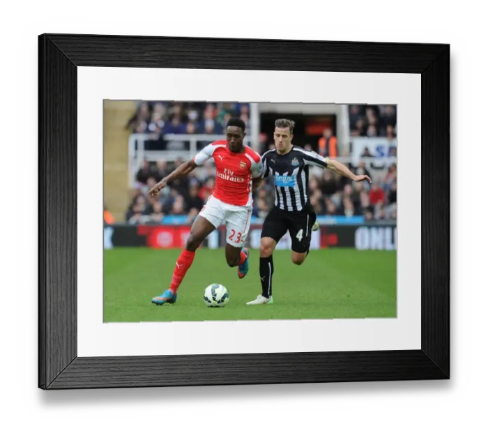 Framed Print : Intense Rivalry: Welbeck vs. Taylor Clash in Newcastle United vs. Arsenal Premier League Match