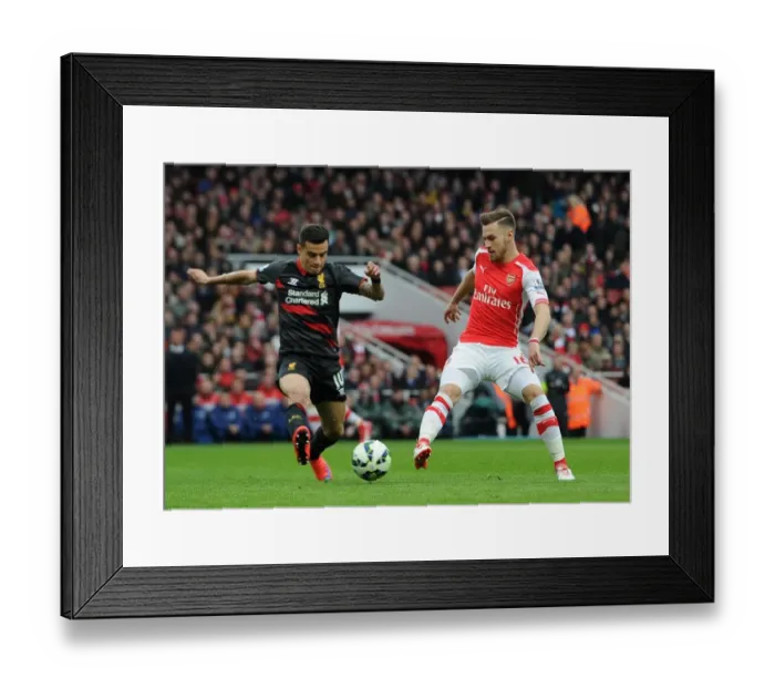 Framed Print : Aaron Ramsey (Arsenal) Philippe Countinho (Liverpool). Arsenal 4: 1 Liverpool. Barclays Framed Print : Aaron Ramsey (Arsenal) Philippe Countinho (Liverpool). Arsenal 4: 1 Liverpool. Barclays