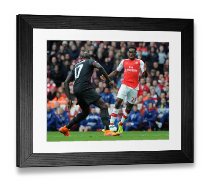Framed Print : Arsenal's Danny Welbeck vs. Liverpool's Mamadou Sakho: Intense Clash in Premier League Showdown Framed Print : Arsenal's Danny Welbeck vs. Liverpool's Mamadou Sakho: Intense Clash in Premier League Showdown