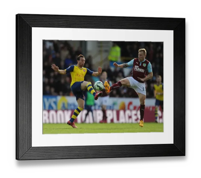 Framed Print : Clash at Turf Moor: Santi Cazorla vs. Ashley Barnes - Intense Battle Between Burnley and Arsenal, Premier League 2014 / 15