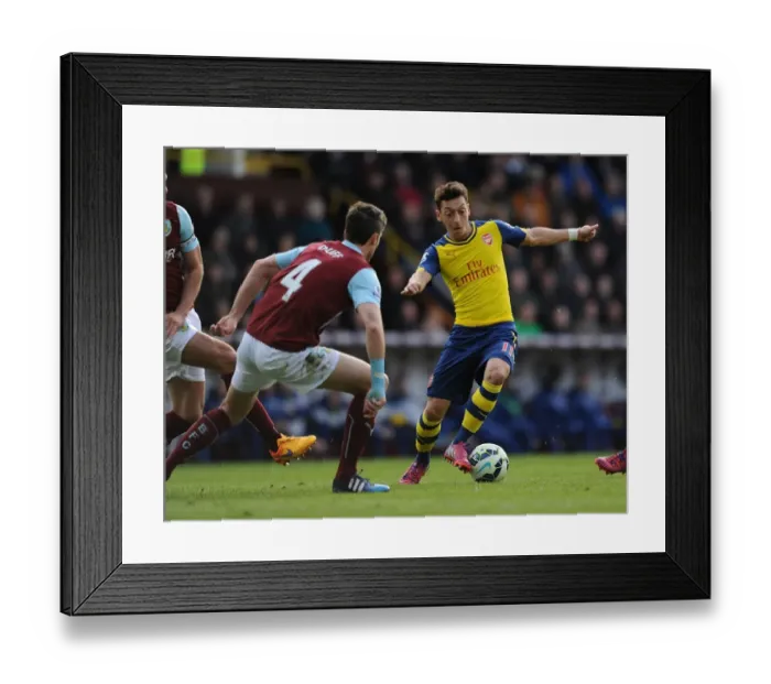 Framed Print : Mesut Ozil vs Michael Duff: A Premier League Battle at Turf Moor, 2014 / 15 Framed Print : Mesut Ozil vs Michael Duff: A Premier League Battle at Turf Moor, 2014 / 15