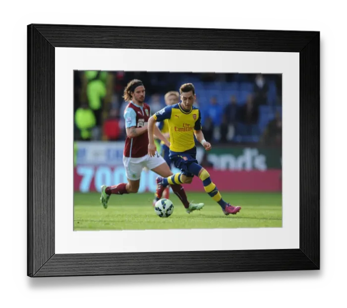 Framed Print : Mesut Ozil vs. George Boyd: A Premier League Battle at Turf Moor, 2014 / 15