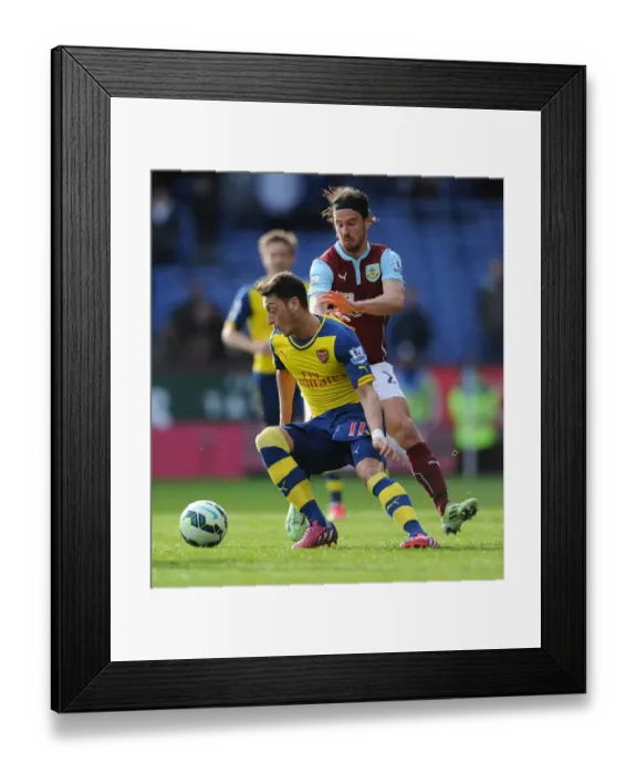 Framed Print : Mesut Ozil vs. George Boyd: A Battle at Turf Moor, Premier League 2014-2015 Framed Print : Mesut Ozil vs. George Boyd: A Battle at Turf Moor, Premier League 2014-2015