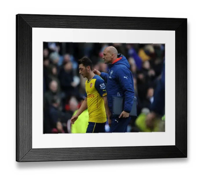 Framed Print : Arsenal's Triumph: Ozil and Bould Celebrate at Burnley's Turf Moor (2014 / 15)