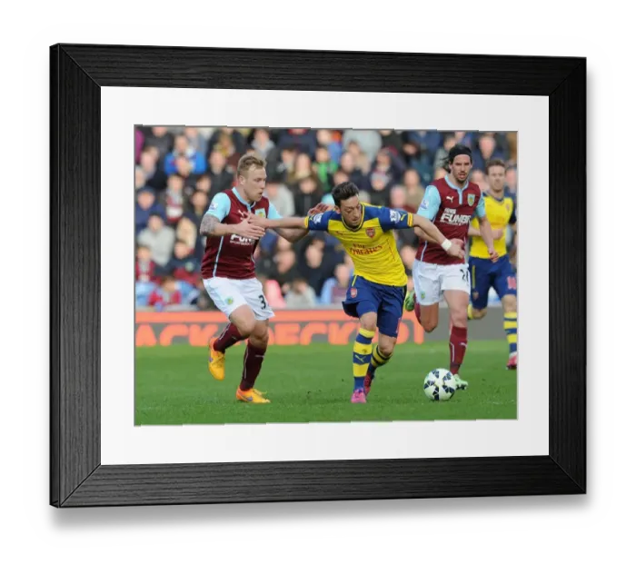 Framed Print : Mesut Ozil vs. Scott Arfield: A Premier League Showdown at Turf Moor