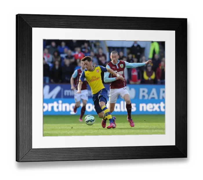 Framed Print : Mesut Ozil vs. David Jones: A Premier League Battle at Turf Moor (2015)