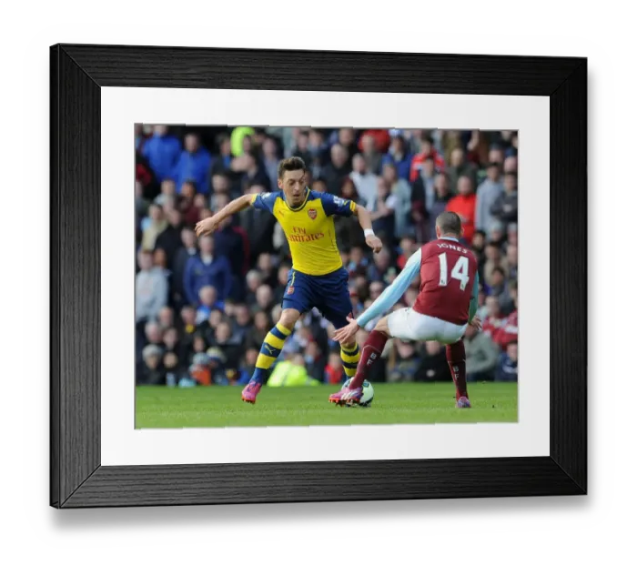 Framed Print : Mesut Ozil vs. David Jones: A Premier League Showdown at Turf Moor (2015) Framed Print : Mesut Ozil vs. David Jones: A Premier League Showdown at Turf Moor (2015)