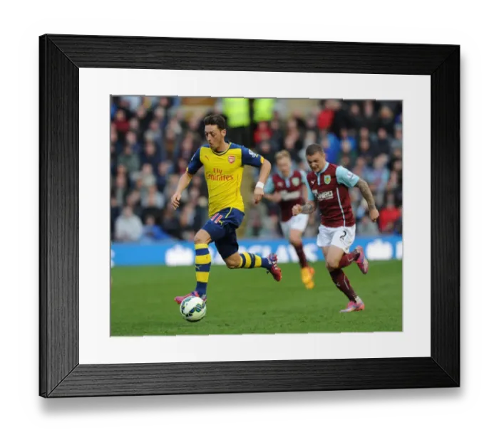 Framed Print : Ozil vs. Trippier: A Premier League Showdown at Turf Moor