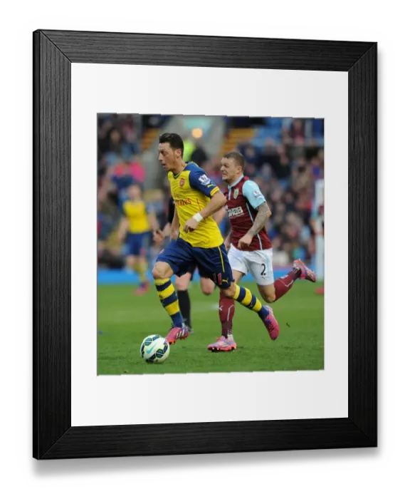 Framed Print : Ozil vs. Trippier: A Premier League Face-Off at Turf Moor