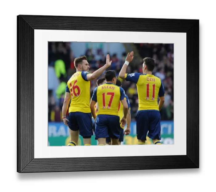 Framed Print : Ramsey and Ozil in Unison: Celebrating a Goal for Arsenal against Burnley, 2014 / 15