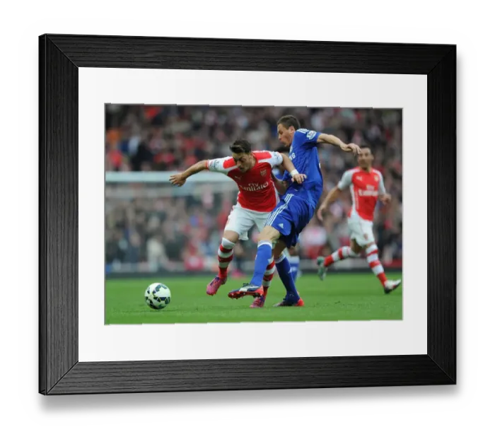 Framed Print : Clash of Midfield Titans: Ozil vs. Matic - Arsenal vs. Chelsea Showdown Framed Print : Clash of Midfield Titans: Ozil vs. Matic - Arsenal vs. Chelsea Showdown