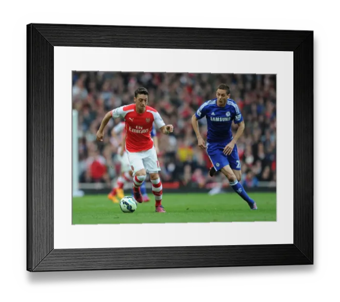 Framed Print : Clash of Midfield Maestros: Ozil vs. Matic - Arsenal vs. Chelsea, Premier League Showdown Framed Print : Clash of Midfield Maestros: Ozil vs. Matic - Arsenal vs. Chelsea, Premier League Showdown