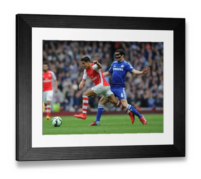 Framed Print : Arsenal's Alexis Sanchez Outmaneuvers Cesc Fabregas: A Tactical Battle at the Emirates Framed Print : Arsenal's Alexis Sanchez Outmaneuvers Cesc Fabregas: A Tactical Battle at the Emirates