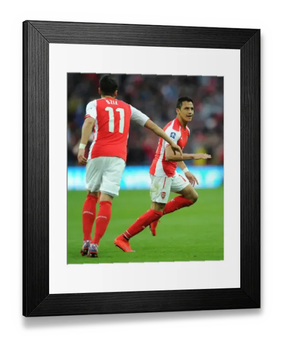 Framed Print : Alexis Sanchez celebrates scoring his and Arsenals 2nd goal. Arsenal 2: 1 Reading
