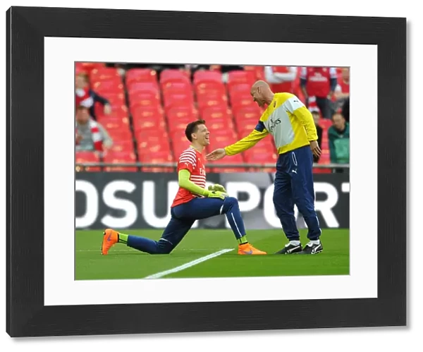 Arsenal's Szczesny and Bould Share a Light-Hearted Moment Before FA Cup Semi-Final vs. Reading