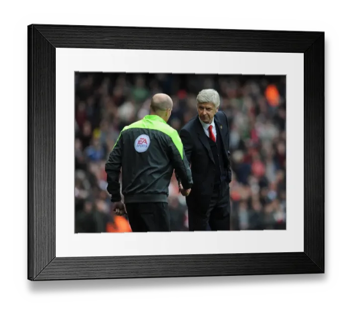 Framed Print : Arsene Wenger the Arsenal Manager shakes hands with Lee Mason the Fourth Official before the match