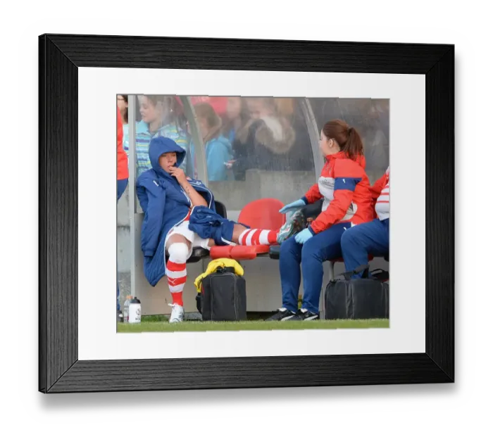 Framed Print : Arsenal's Jordan Nobbs Comforted by Physio After Suffering Injury Against Chelsea Ladies