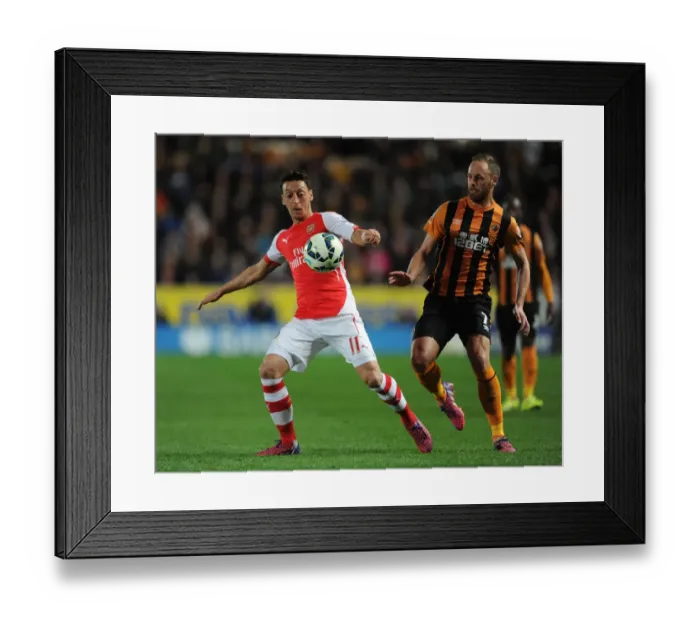 Framed Print : Mesut Ozil vs David Meyler: Intense Battle at KC Stadium, Hull City vs Arsenal, Premier League 2014 / 15 Framed Print : Mesut Ozil vs David Meyler: Intense Battle at KC Stadium, Hull City vs Arsenal, Premier League 2014 / 15